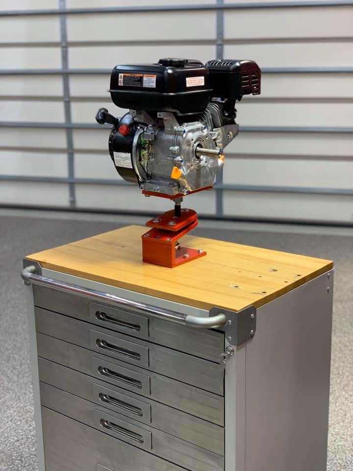 A Mechanical Classroom learning station: an engine on a stand atop a rolling tool chest