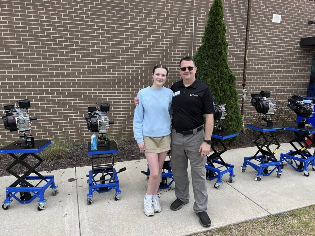 Ava and Jake Raby with a row of Mechanical Classroom learning stations
