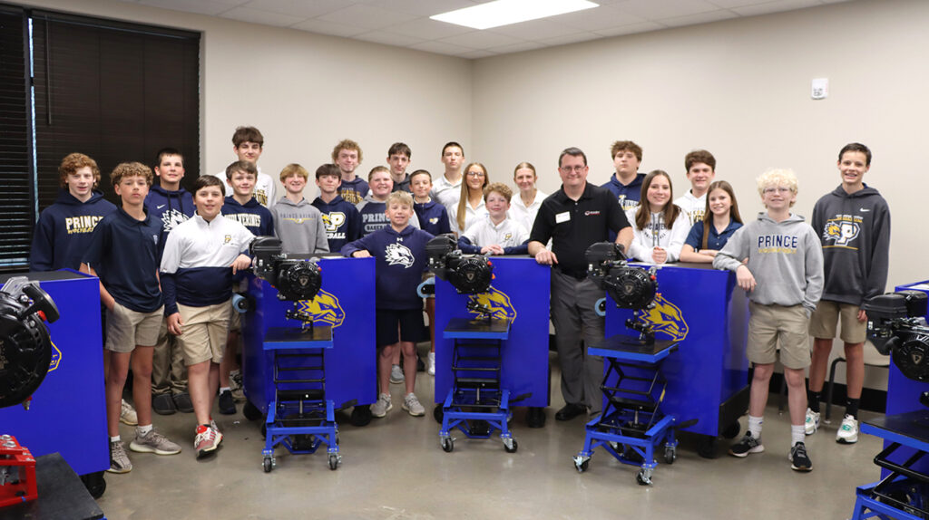 Students and Jake Raby with learning stations